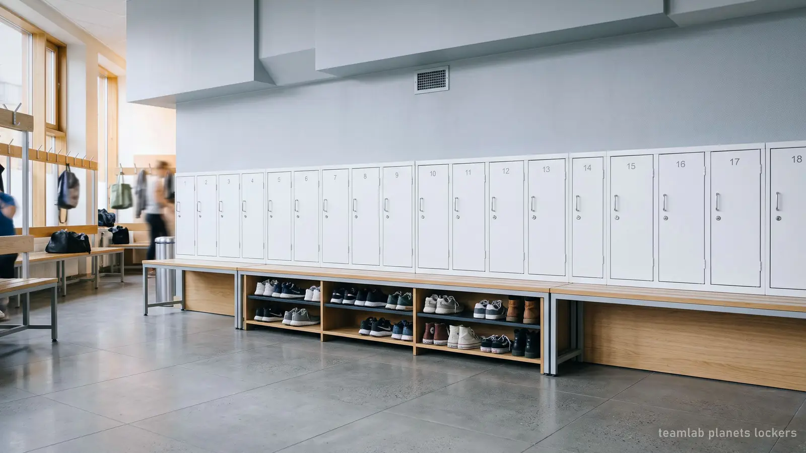 Illustration: a row of small lockers with shoes on a rack below, like the free lockers at teamLab Planets